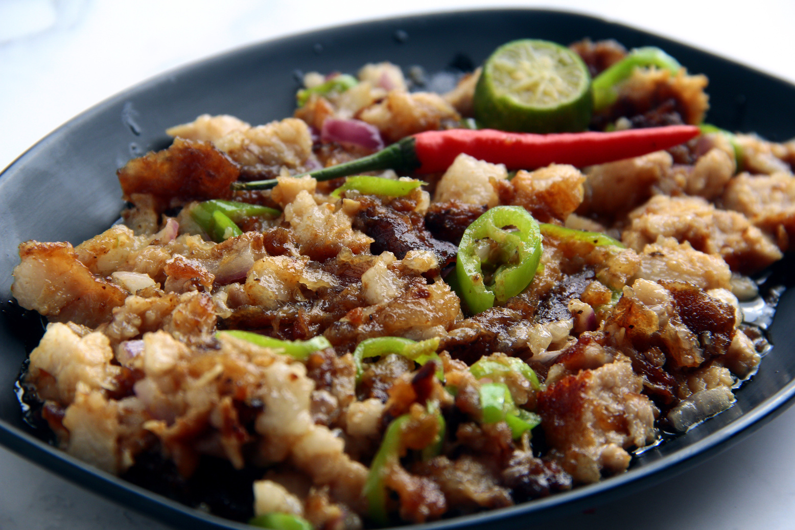 reshly cooked Filipino food called Pork Sisig